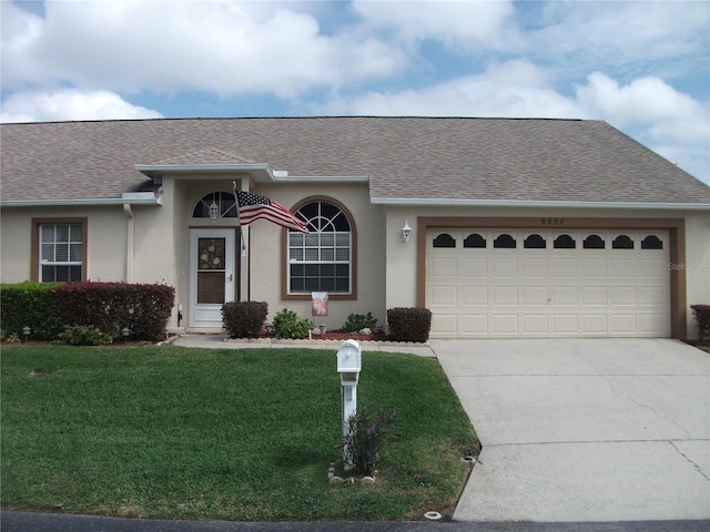 ranch-style house with a front yard and a garage