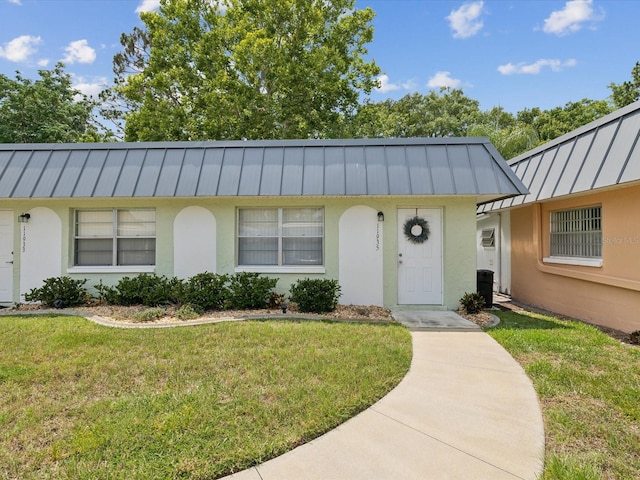 ranch-style house with a front yard