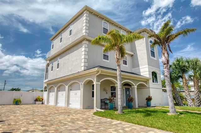 view of front of home featuring a garage and a front yard