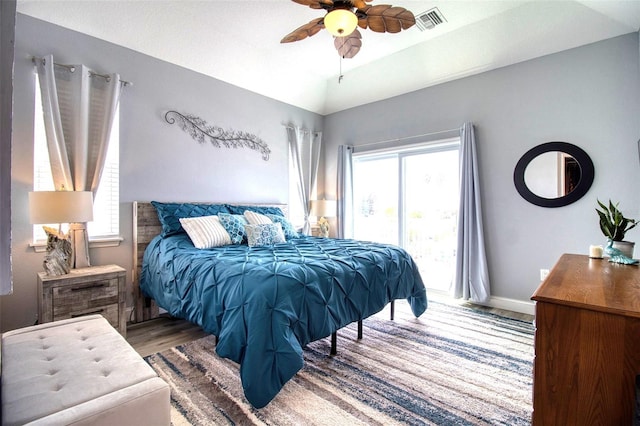 bedroom with a ceiling fan, visible vents, vaulted ceiling, access to outside, and baseboards