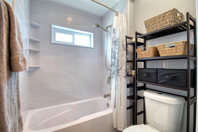 bathroom with shower / bath combination with curtain and toilet