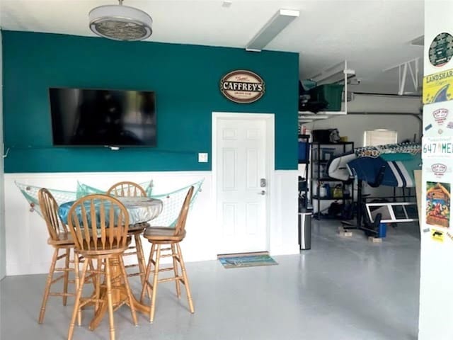 dining room with concrete floors