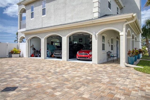 garage featuring decorative driveway