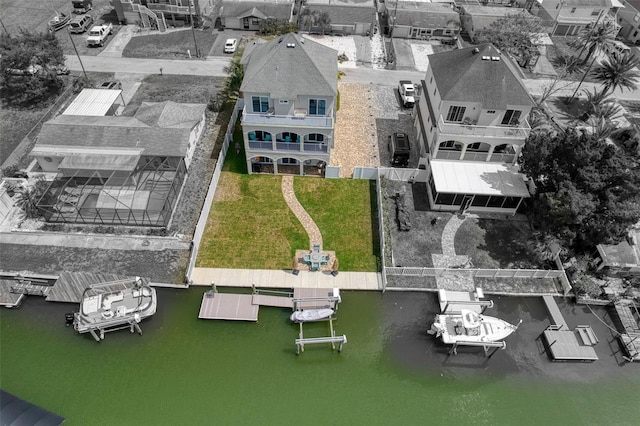 drone / aerial view with a residential view and a water view