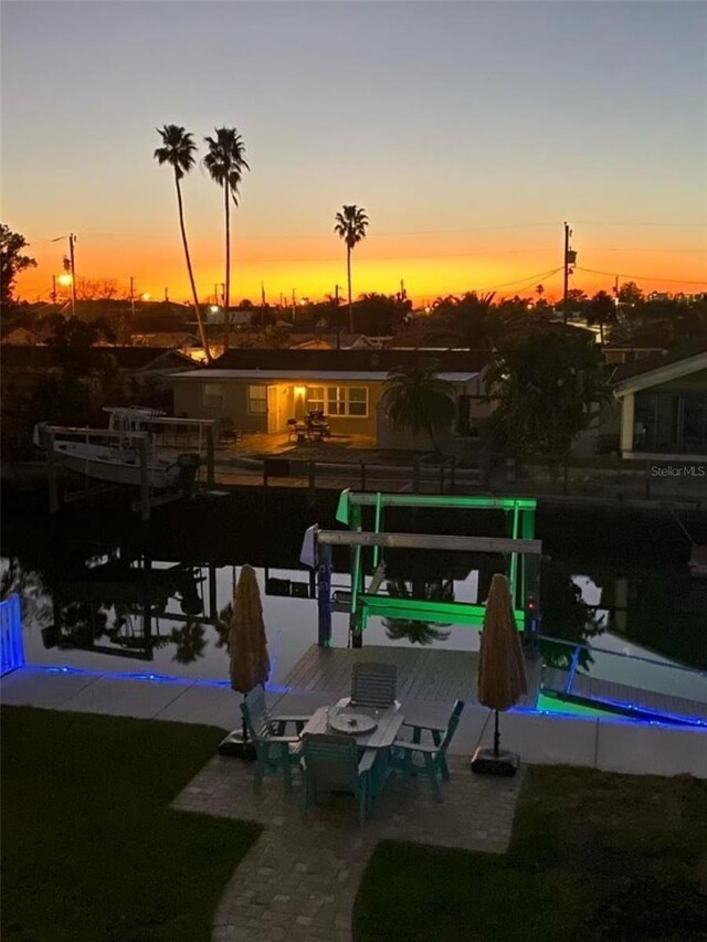 exterior space with a dock and boat lift