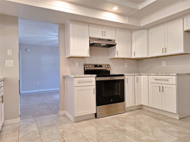 kitchen with under cabinet range hood, light countertops, white cabinetry, and stainless steel range with electric cooktop