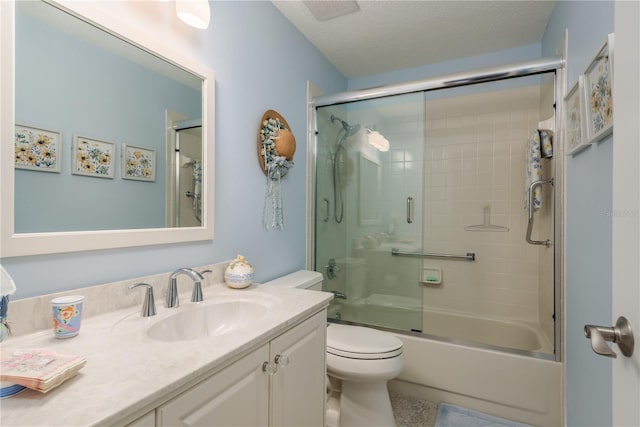 full bathroom with toilet, shower / bath combination with glass door, a textured ceiling, vanity, and tile flooring