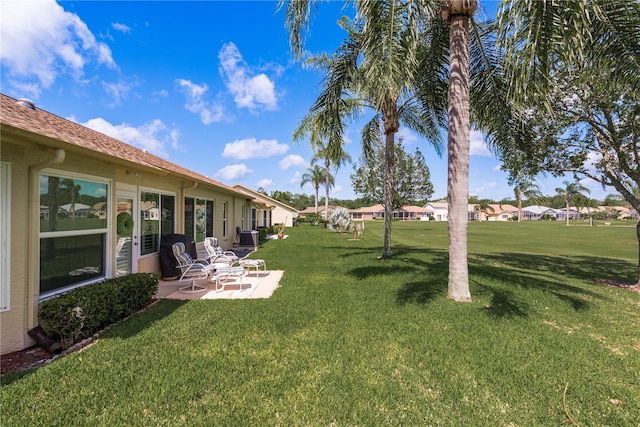 view of yard featuring central AC unit and a patio area