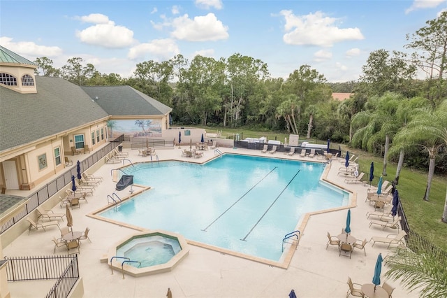 view of swimming pool with a community hot tub and a patio