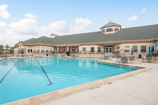 view of swimming pool with a patio area