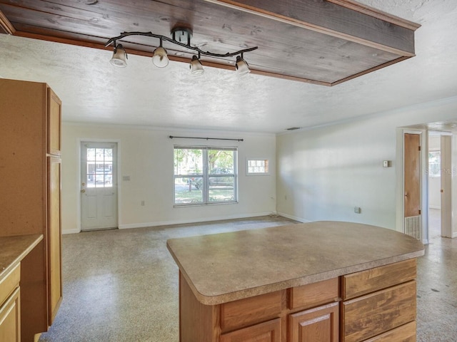 kitchen featuring a center island and wooden ceiling