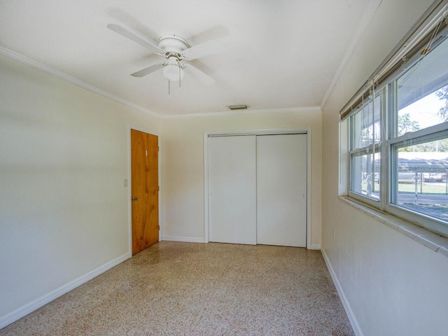 unfurnished bedroom with a closet, ceiling fan, and ornamental molding