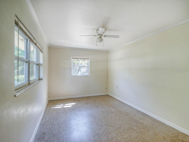 unfurnished room featuring ceiling fan and ornamental molding