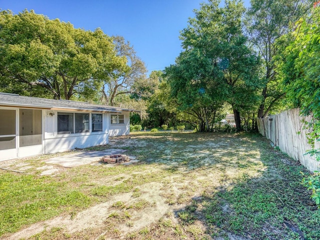 view of yard with a sunroom