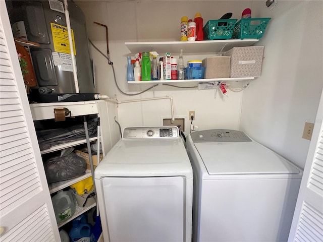 washroom featuring washer and dryer and electric water heater