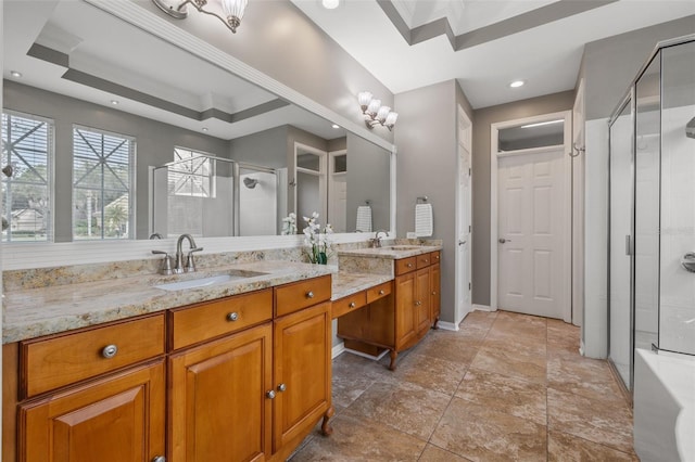 bathroom with vanity, a shower with door, ornamental molding, and a tray ceiling