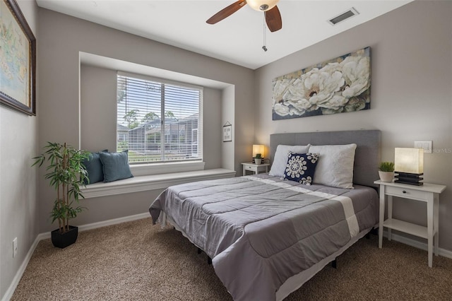 bedroom featuring ceiling fan and carpet