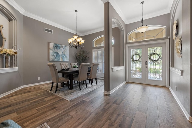 dining room featuring dark hardwood / wood-style flooring, french doors, and ornamental molding