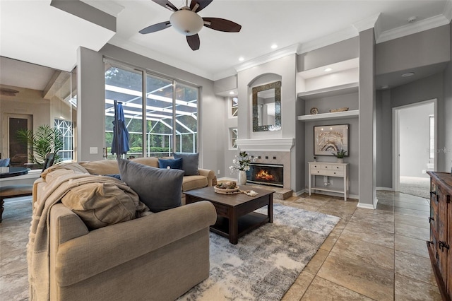 living room featuring ceiling fan and crown molding