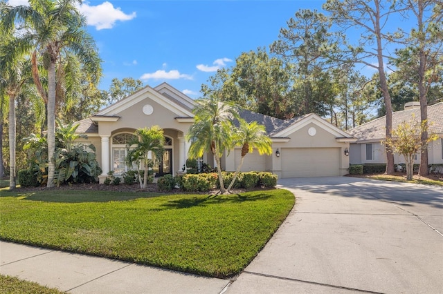 view of front of property featuring a garage and a front lawn