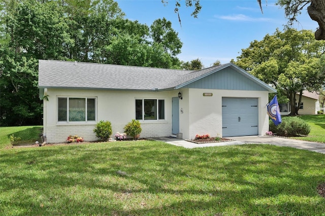 single story home with a front yard and a garage