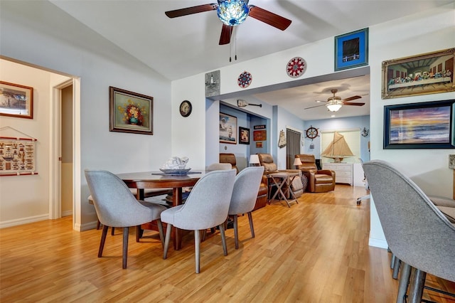 dining space with ceiling fan and light hardwood / wood-style flooring