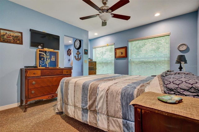 bedroom with ceiling fan and light carpet