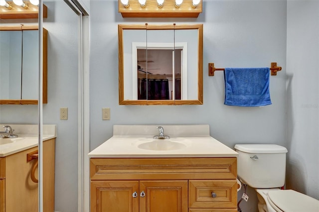 bathroom with toilet and vanity