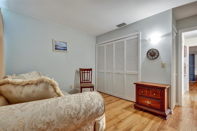 sitting room with light hardwood / wood-style flooring