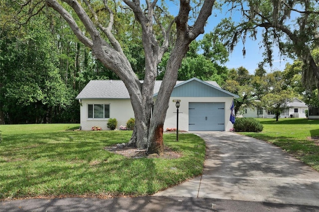 single story home with a front yard and a garage