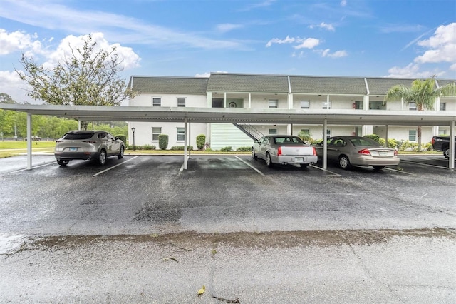 view of vehicle parking with a carport