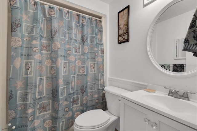 bathroom featuring oversized vanity and toilet