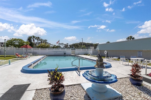 view of swimming pool featuring a patio area