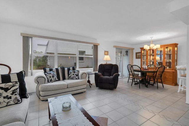 living room with a notable chandelier and light tile flooring