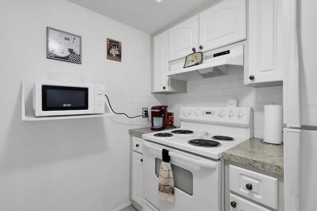 kitchen with white cabinets, white appliances, and tasteful backsplash