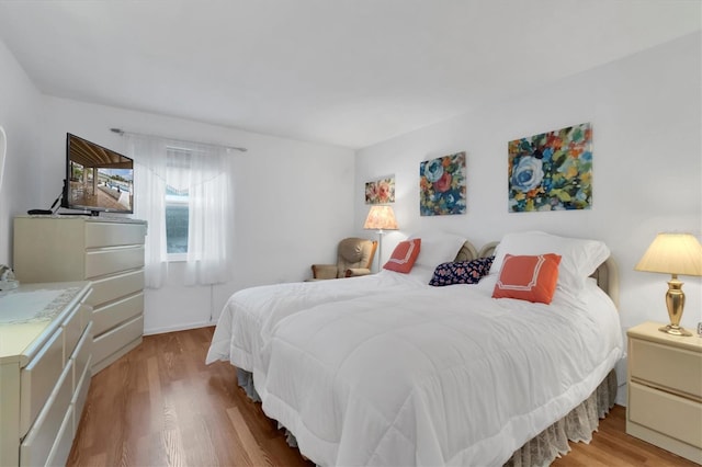 bedroom with light hardwood / wood-style flooring