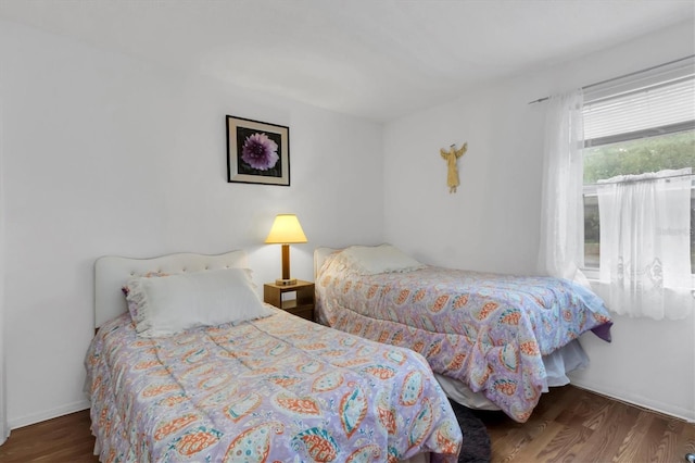 bedroom featuring dark wood-type flooring