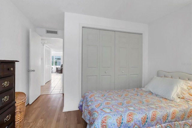 tiled bedroom featuring a closet