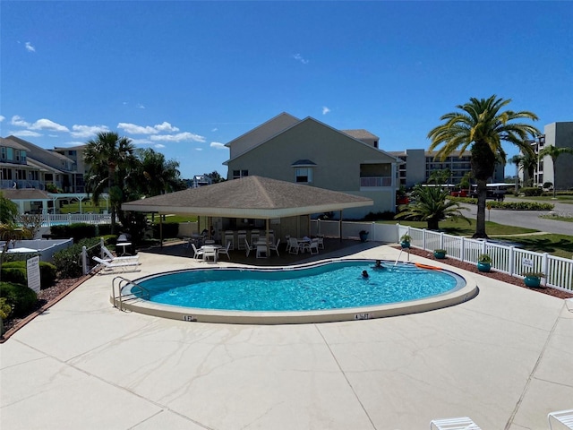 view of swimming pool with a patio area