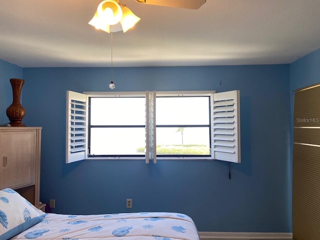 unfurnished bedroom featuring ceiling fan