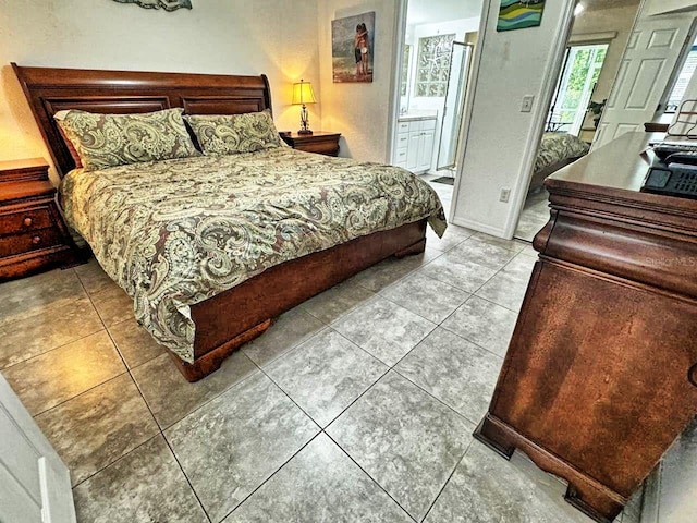 tiled bedroom with ensuite bath