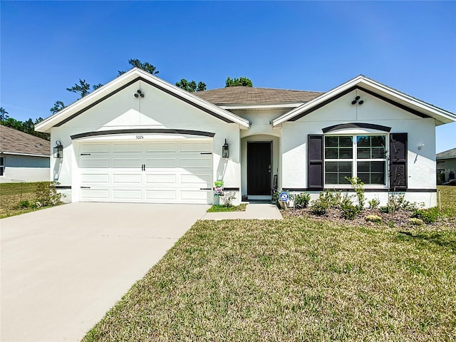 single story home featuring a garage and a front lawn