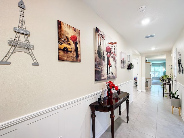 hallway with light tile flooring