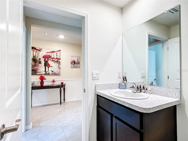 bathroom featuring vanity and tile floors