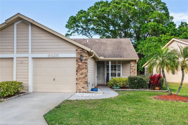 view of front of property with a garage and a front yard