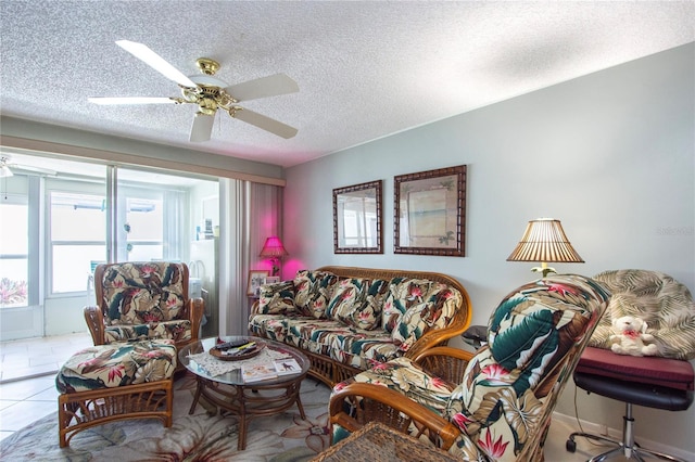 tiled living room with ceiling fan and a textured ceiling