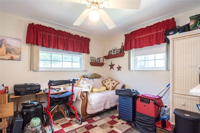 interior space with ceiling fan and multiple windows