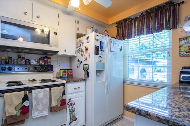 kitchen with white cabinets, white appliances, tasteful backsplash, and ceiling fan