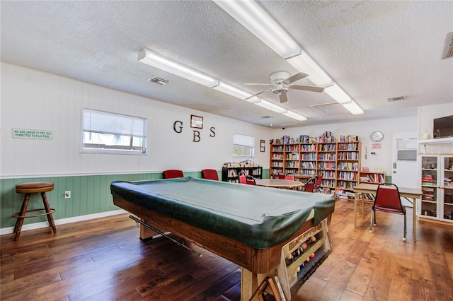 recreation room with wood-type flooring, ceiling fan, a textured ceiling, and billiards