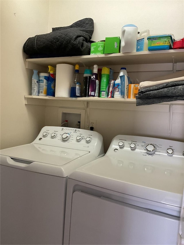 laundry area with washing machine and clothes dryer